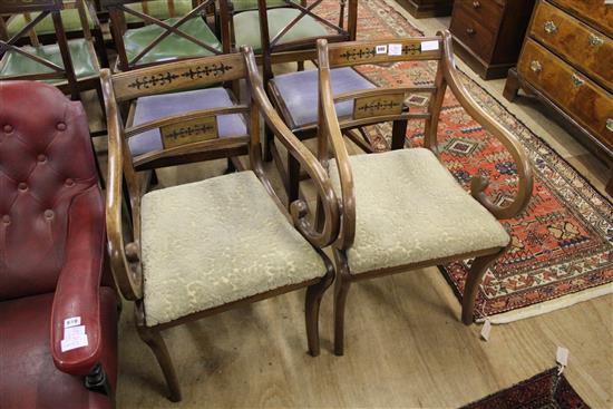 Pair of Regency style mahogany open armchairs with scroll arms and sabre legs(-)